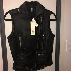 A black leather vest never worn new with tags